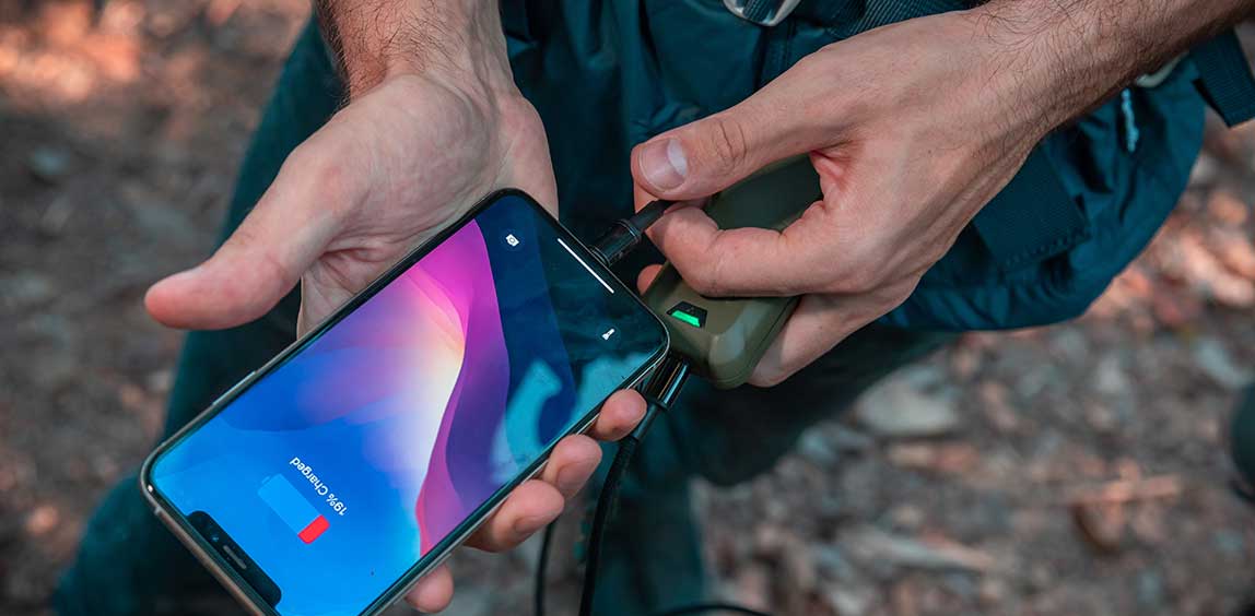 Flextail Max Repeller S — USB-C charging cable connected on a tabletop.