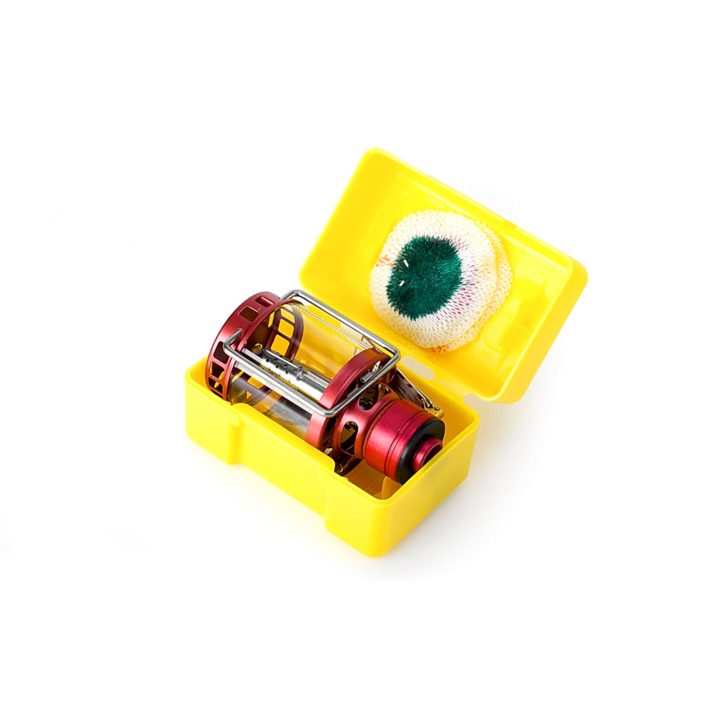 Kovea Firefly Lantern in yellow case for compact travel, with gas lamp and piezo ignition, ideal for camping lighting solution.