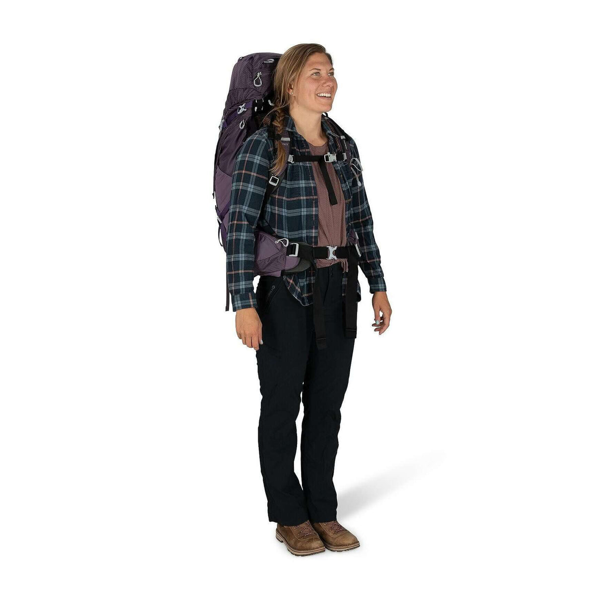 Woman wearing Osprey Aura AG 50 backpack with AntiGravity suspension for comfort on overnight trips.