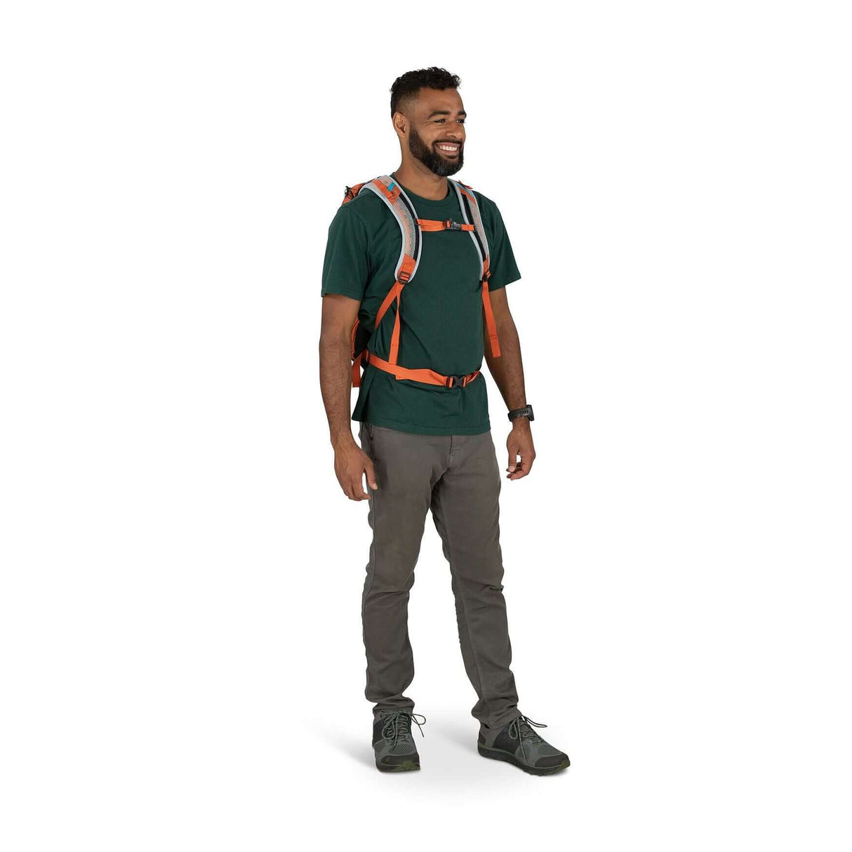 Man wearing Osprey Hikelite 18 daypack with AirSpeed ventilation for hiking.