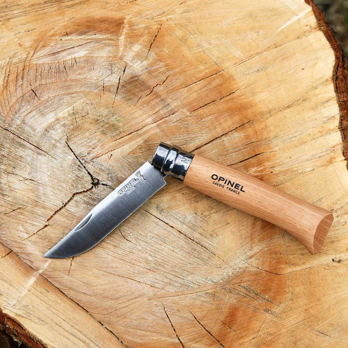 Opinel Traditional Stainless Steel Knife with Virobloc safety ring on wooden surface, ideal for camping and daily manual work.