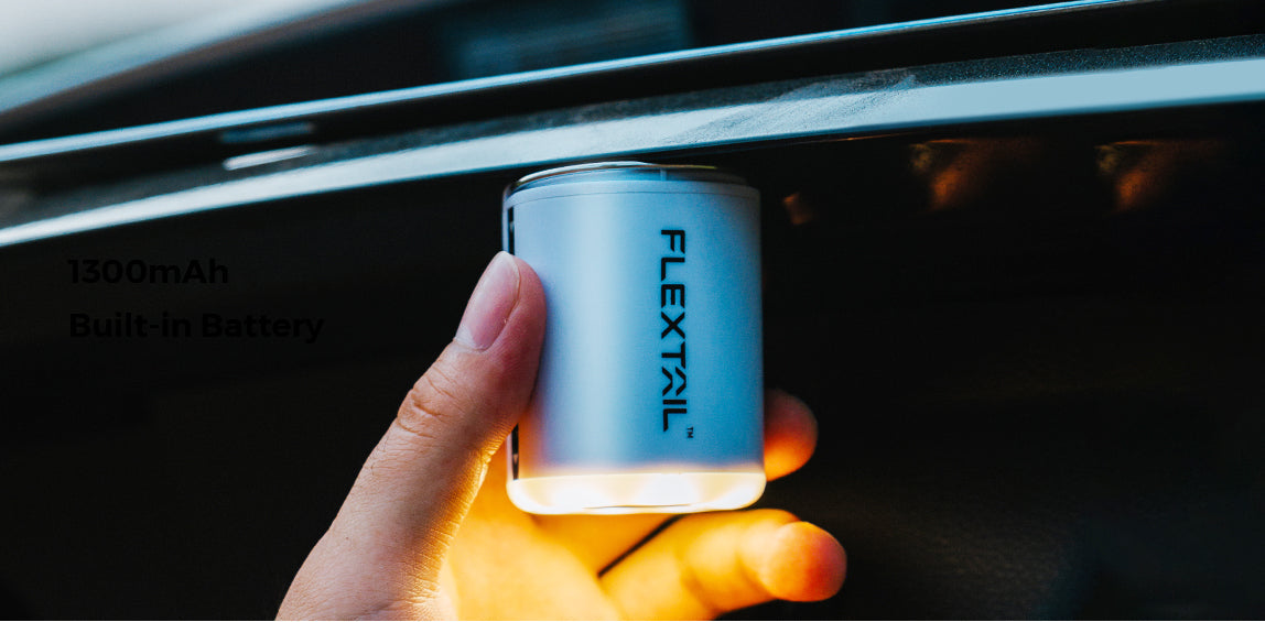 Person using Flextail Tiny Pump 2X as a lantern showing 1300mAh battery capacity