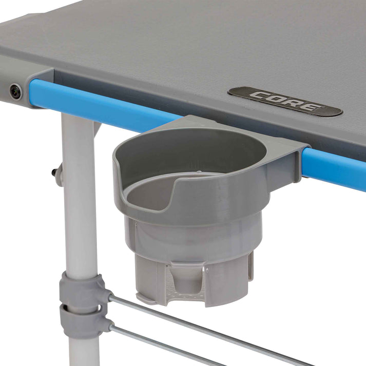 Core Equipment 4 Foot Outdoor Table with FlexRail — lantern/cup holder attachments on the FlexRail.