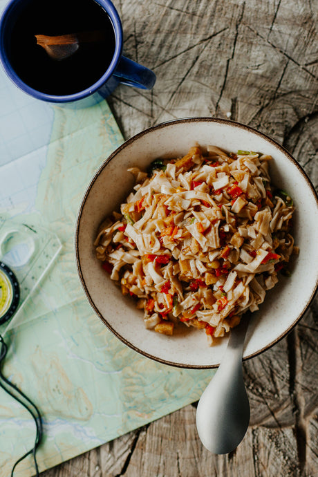 Bowl of Back Country Cuisine Vegetarian Stir Fry with map and compass.