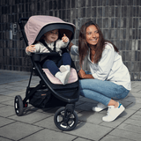 Thule Spring Canopy - Gray Melange stroller shown with vented, extendable canopy featuring UPF 50+ protection for sunny days.