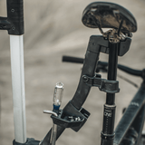 Thule Verse Bike Repair Holder shown in use for trailhead bike maintenance. Premium Thule accessory for seamless integration and quick deployment.