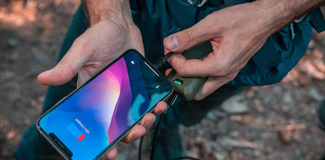 Flextail Max Repeller S — USB-C charging cable connected on a tabletop.