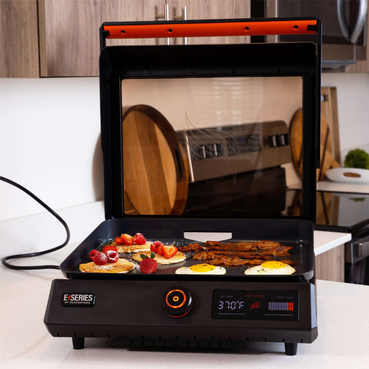 Blackstone E-Series Electric Tabletop Griddle cooking eggs and pancakes