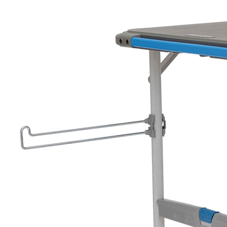 Core Equipment 4 Foot Outdoor Table with FlexRail — accessories organized along the rail during outdoor cooking.