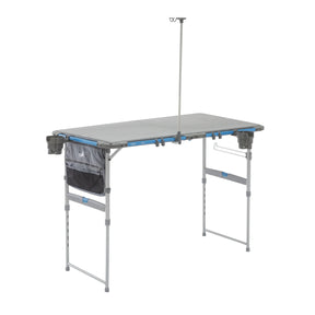 Core Equipment 4 Foot Outdoor Table with FlexRail — front view set up at campsite.