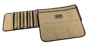 ARB Tool Roll Bag — closed roll with PVC outer and buckle straps, front view.