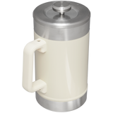 Stanley Classic Stay Hot French Press - 48 oz / 1.4 L in cream color with stainless steel lid and handle.