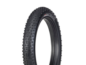 Black tire with tread pattern on a white background