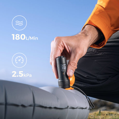 Flextail Zero Pump — inflating backpacking sleeping pad at campsite.