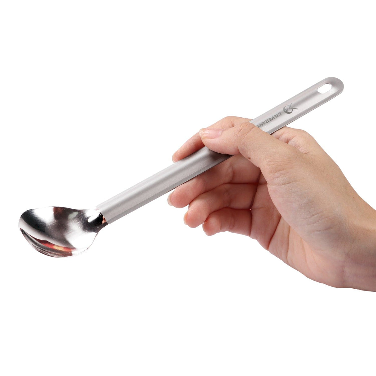 Hand holding SilverAnt Long Handle Titanium Spoon, ultralight camping gear ideal for outdoor adventures and efficient meal times on the trail.