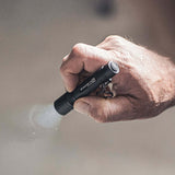 P3R compact flashlight being held, showcasing focusable light and robust design for everyday carry.